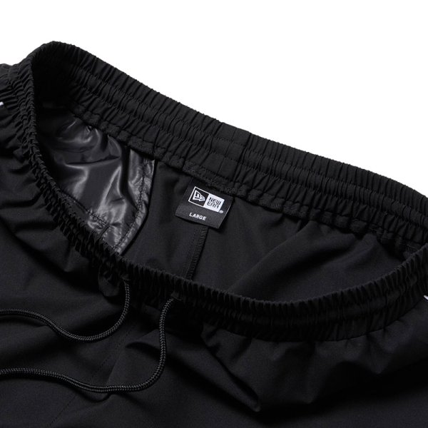 画像7: NEWERA（ニューエラ）“オーバーサイズド パイピング トラックパンツ ブラック/グレー | パフォーマンスアパレル” (7)